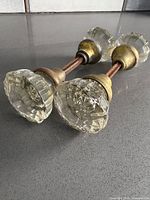 Two spindle-mounted faceted glass door knob assemblies, overall view