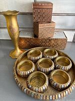Group view of vase, four boxes, tray and coasters