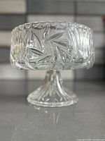 Side view of lead crystal pedestal bowl showing pinwheel cuts and pedestal base