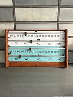 Front view showing full scoreboard, numerals, markers and frame