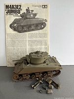 Assembled Jumbo Sherman tank model with instruction booklet