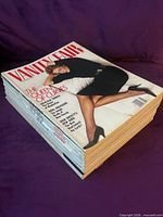Angle view of entire stacked lot of Vanity Fair magazines