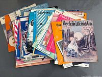 Spread of assorted vintage sheet music titles