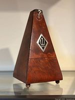 Closed wooden Wittner metronome on shelf