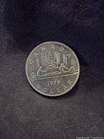 Reverse side showing canoe design and date