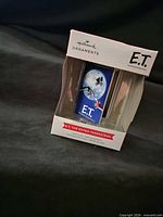 Front angled view of Hallmark E.T. VHS ornament inside box