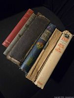 Six books laid flat showing spines