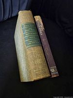 Hardcover and paperback books side by side showing spines