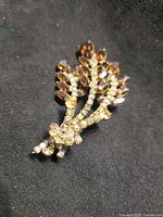 Front view of brooch showing design and rhinestones