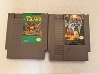 Front view of two NES cartridges: Adventure Island and Back to the Future