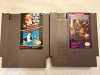 Front view of both NES cartridges showing labels and condition