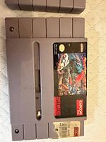 Close-up Street Fighter II SNES cartridge front label showing wear and residue