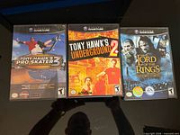 Front view of three GameCube game cases showing cover art