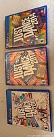 Three Just Dance game cases stacked vertically