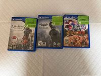 Front view of three cased PS Vita games