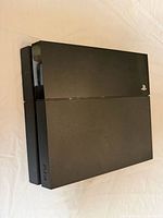 Top view of Sony PS4 console showing overall condition