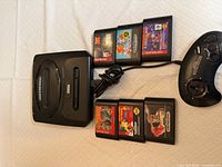 Console, controller and six cartridges overview