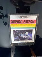 Front view of Imagic Demon Attack Atari cartridge showing label and overall condition
