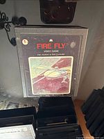 Front view of Fire Fly Atari 2600 box standing upright