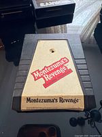 Front view of Atari 2600 Montezuma's Revenge cartridge showing label and overall condition