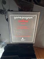 Front view of Atari Outlaw CX-2605 cartridge showing label text and condition
