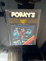 Front view of Porky's Atari 2600 cartridge showing full label and branding
