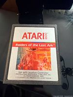 Front view of Atari 2600 Raiders of the Lost Ark cartridge showing label and artwork