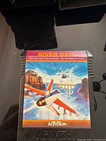 Front view of Activision River Raid cartridge showing label art and title