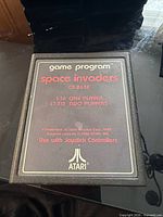 Front view of Atari CX-2632 Space Invaders cartridge showing label details