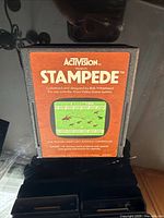 Front view of Activision Stampede Atari 2600 cartridge showing label details