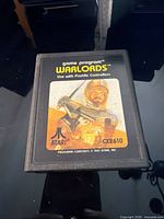 Front view of Atari 2600 Warlords cartridge showing label details