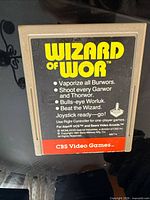Front view of Wizard of Wor Atari 2600 cartridge showing label text and condition