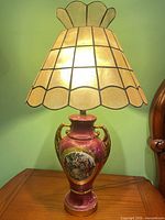 Full view of lamp illuminated on table