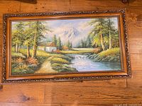 Full view of framed oil landscape painting