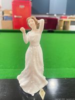 Front view of Royal Doulton Sentiments With Love figurine on table