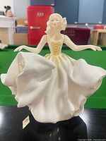 Front view of Royal Doulton Sweet Seventeen figurine showing dress detail