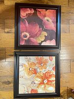 Both framed floral prints displayed vertically