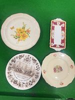 Front view of four plates and tray