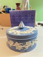 Covered trinket box front view with original box in background