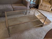 Side perspective of table with both glass tiers visible