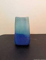 Front view of rectangular aqua to blue-purple glass vase