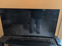 Front view of Hisense 40-inch TV on stand