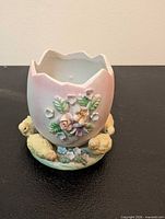 Front view showing floral relief and ducklings