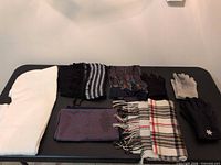 All gloves and scarves displayed on table