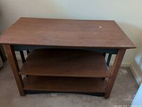 Front view showing top, two shelves, side slats