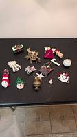 Group shot of all ornaments displayed on black surface