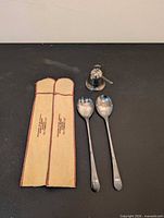 Overview of fork, spoon, sleeves and 1994 bell