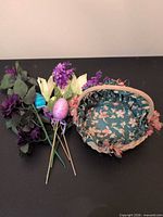 Basket with liner, artificial flower cluster and egg picks shown together