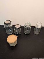 All five containers grouped on tabletop