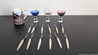 Group view of 12 cocktail forks, 3 cordial glasses, Pisa mug